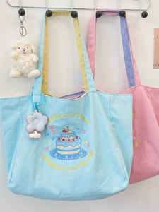 Contrast color canvas tote bag with cake embroidery and shoulder strap detail