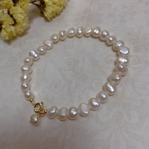Detail of baroque freshwater pearl bracelet with 14K gold filled ring clasp closure