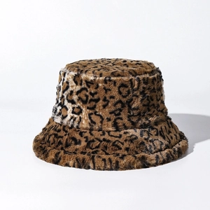 Close-up of the soft faux fur texture and brown leopard print pattern on the winter bucket hat
