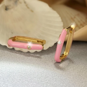 Detail of pink enamel geometric hoop earrings with sparkling cubic zirconia inlay