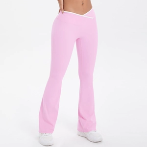 Detailed close-up of V-shaped high waist and contrast trim on pink flare yoga pants