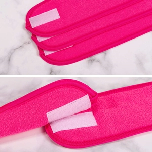 Close-up of pink spa headband featuring soft terry fabric and adjustable velcro closure