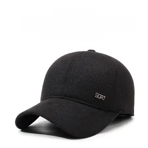 Close-up of wool baseball cap with metal SORT logo and integrated ear protection flaps