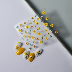 Macro detail of sunflower and bee nail stickers with embossed 5D texture for nail art