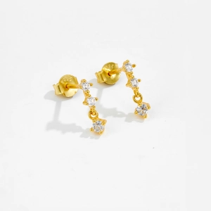 Close-up of gold-plated S925 sterling silver earrings with three sparkling round zircons