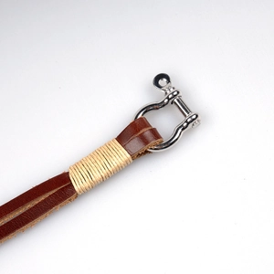 Handmade woven brown leather bracelet with vintage silver horseshoe buckle for men