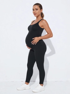 Seamless maternity yoga jumpsuit in black, featuring high elasticity and belly support