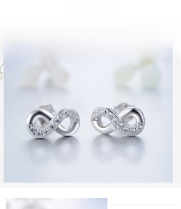 Close-up of infinity stud earrings in S925 sterling silver with micro-pave white zircons