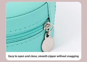 Detail of mint green PU leather jewelry box featuring a smooth metal zipper and disk puller