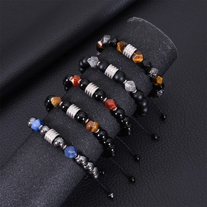 Macro view of adjustable woven bracelets featuring tiger eye, agate and hematite beads