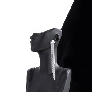 Silver long tassel earrings in stainless steel on mannequin for a luxury stylish look