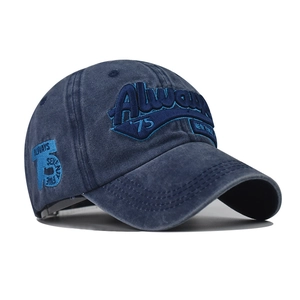 Close-up of deep blue washed cotton baseball cap with 3D Always 75 letter embroidery