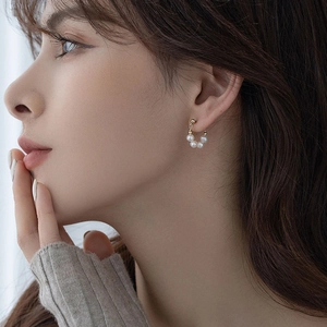 Elegant S925 silver needle Baroque freshwater pearl hoop earrings on female model