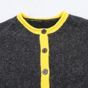 Women's dark grey knit cardigan with contrasting yellow collar and button closure