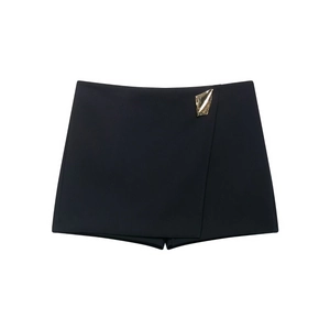 Women's black high-waisted asymmetric skort with gold irregular geometric metal detail