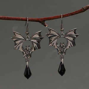 Detail of gothic bat earrings with faceted black teardrop crystals on branches