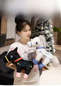 Detailed close-up of cute stuffed horse plush toys with floral embroidery and fluffy manes