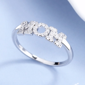 Macro shot of S925 sterling silver ring with MOM lettering and micro-pave zircons