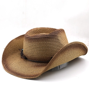 Classic western style woven cowboy straw hat in brown with wide brim for sun protection