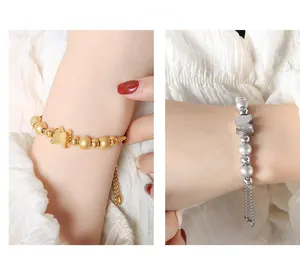 Detail of beaded butterfly bracelets in gold and silver with adjustable drawstring chains