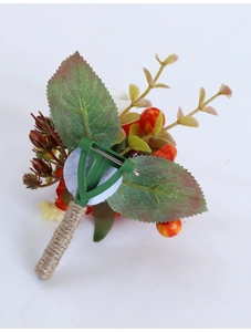 Detail of bridal boutonniere featuring white petals and rustic twine-wrapped stem with clip