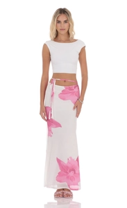 Detail of a mesh floral skirt with pink flower print and adjustable side ties