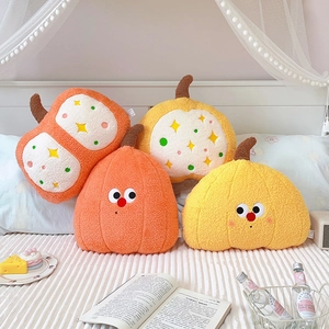 Plush pumpkin throw pillows in orange and yellow soft fleece for cozy home decor