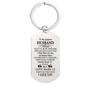 Macro shot of engraved English love poem on silver stainless steel military tag keychain