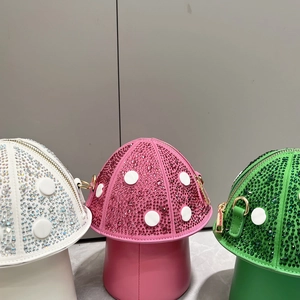 Mushroom-shaped rhinestone handbags in white, pink and green with sparkling polka dots
