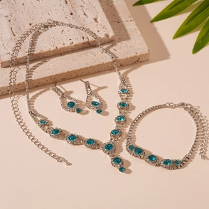 Elegant vintage 3-piece jewelry set with blue gemstones and silver diamond accents