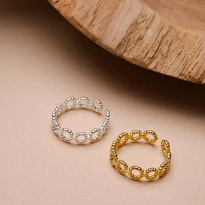 Detailed close-up of 925 silver hollow chain rings in gold and silver finishes