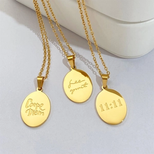 Gold oval pendant necklaces with 11:11, Free Spirit, and Carpe Diem engravings
