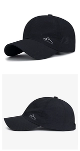 Detailed close-up of breathable black mesh cap featuring a side mountain graphic and text