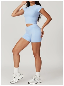 Light blue two-piece athletic yoga set showing slim fit crop top and high waist shorts