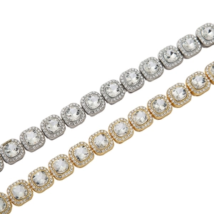 Detail of gold and silver hip hop necklaces with square iced out crystal links