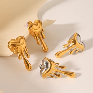 Two-tone heart-shaped lava stud earrings in polished gold and silver stainless steel