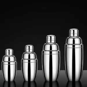 Polished stainless steel cocktail shaker set in four sizes on a dark background