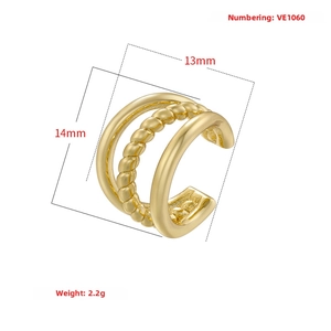 Detail view of triple-layered golden ear cuff with twist design and 14mm dimensions