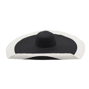 Detail of wide-brim straw hat with black crown and contrasting beige wavy edge