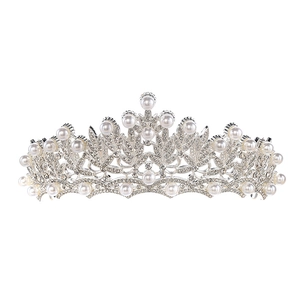 Macro shot of silver wedding crown with white pearls and sparkling rhinestone details