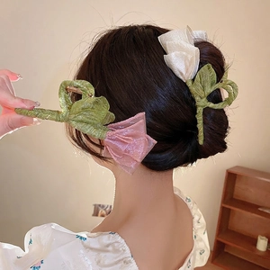 Elegant tulip style fabric bow hair claw clips in pastel green and pink for women