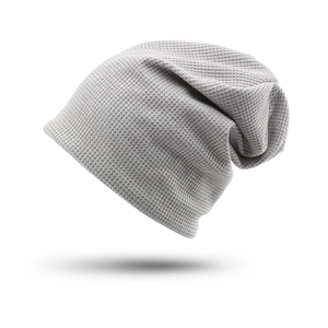 Close-up of light grey beanie showing detailed waffle knit texture and soft fabric