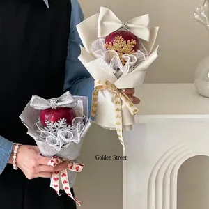 Sparkling Christmas apple gift wrap with gold snowflakes and glittery ribbon decor