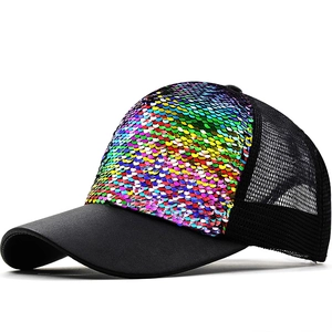 Rainbow sequin trucker hat with black breathable mesh and curved brim in 45-degree view