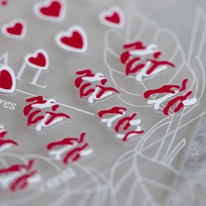 3D embossed nail art stickers with red hearts and white streamline patterns