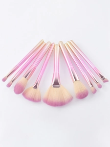 Detail of 9-piece makeup brush set featuring pink gradient handles and soft fiber bristles