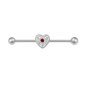 Macro view of silver industrial barbell with heart spiderweb and red zircon inlay