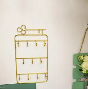 Golden key-shaped wall jewelry organizer with 3 tiers and 11 hooks, weighing only 120g