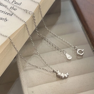 Detail of S925 sterling silver croissant pendant with adjustable extension chain