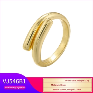 Detailed macro view of gold-plated brass ring with twisted knot design and dimensions